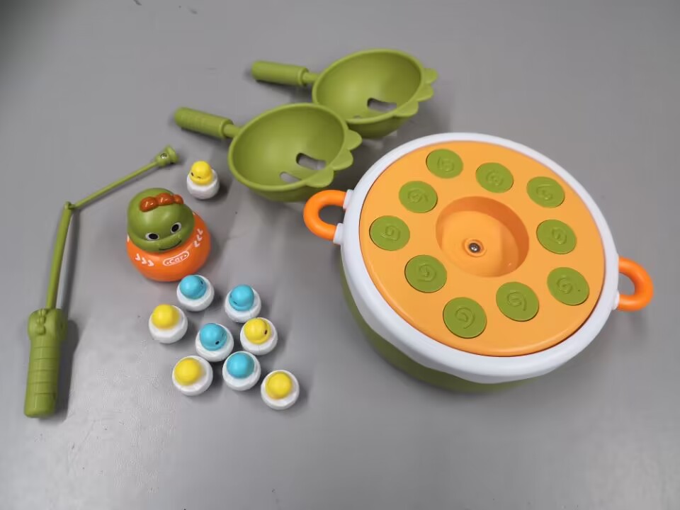 Photographed tabletop fishing game with the included play pieces